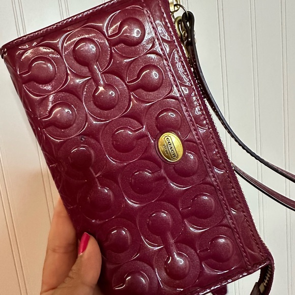 Coach Handbags - Coach Maroon Embossed Clutch